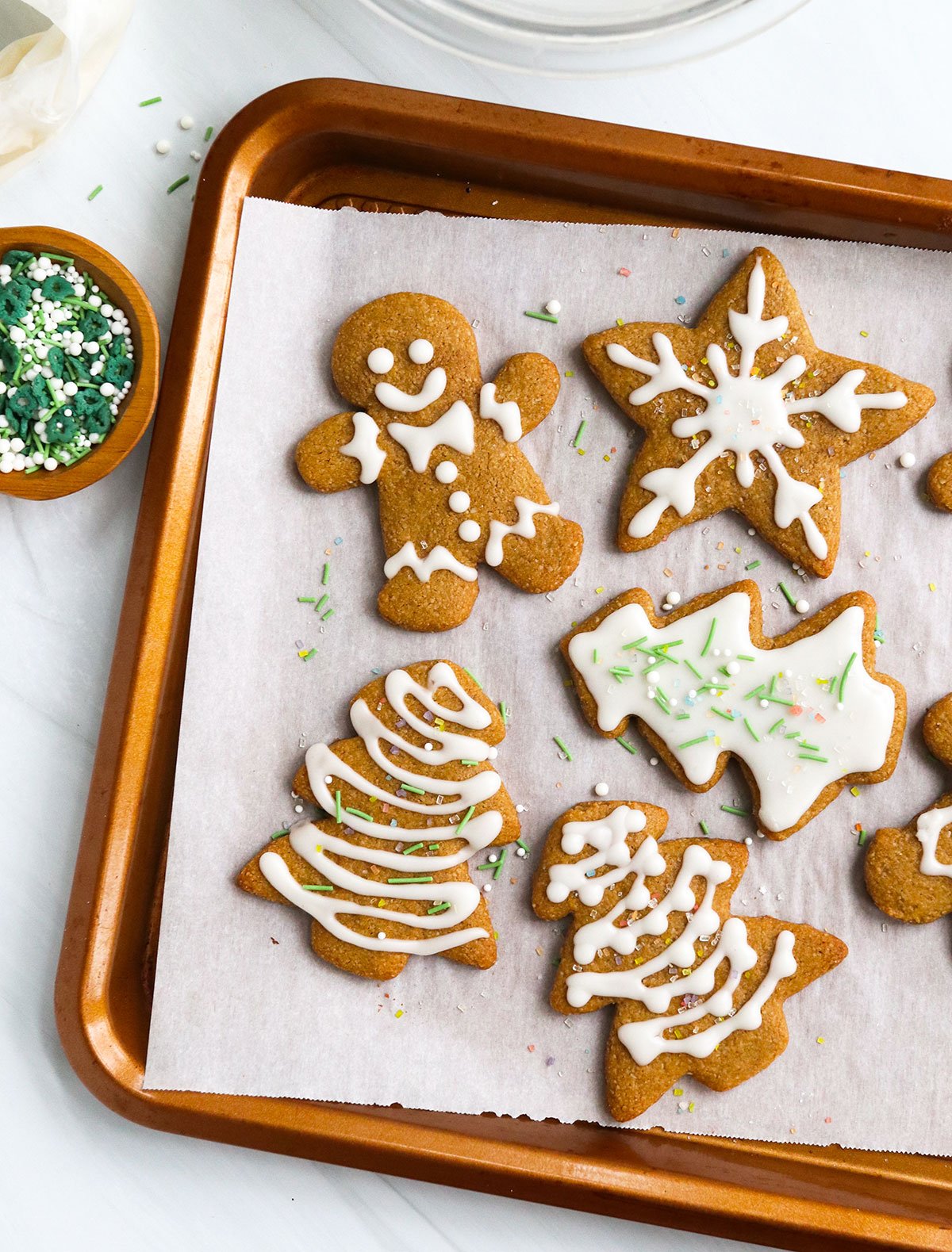 almond flour gingerbread cookies on a baking sheet.