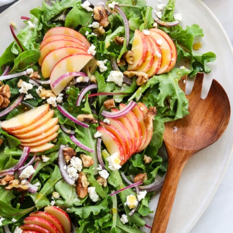 apple walnut salad served with wooden spork.