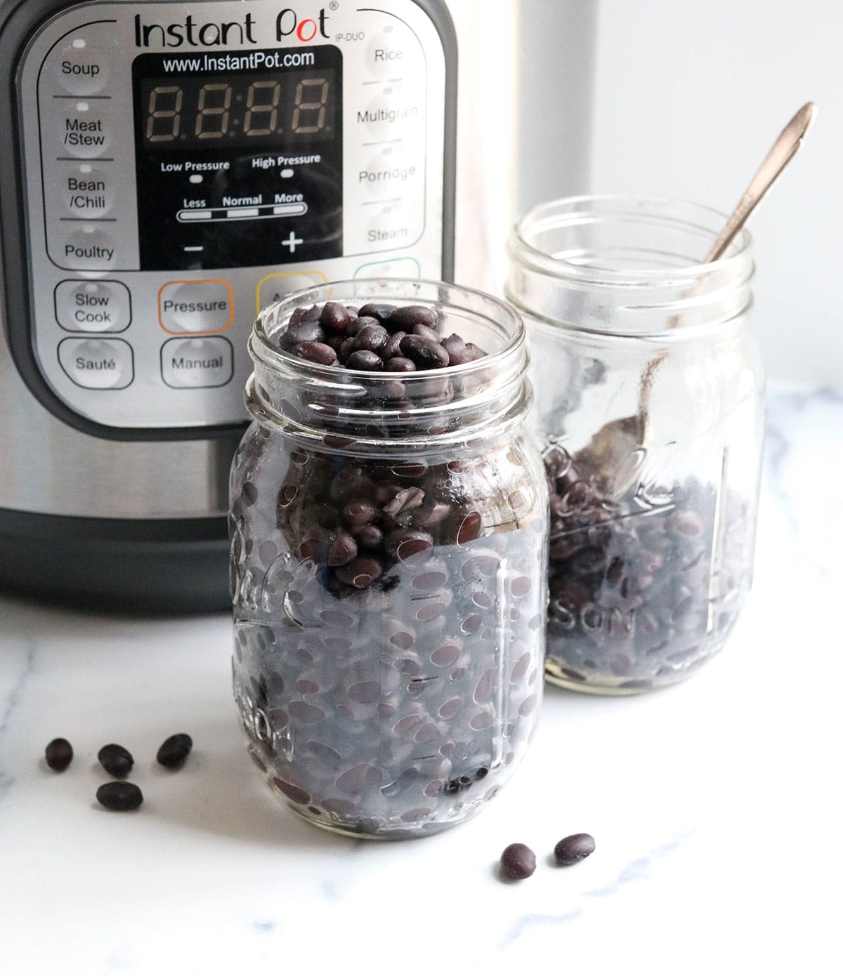 jar of black beans next to Instant Pot