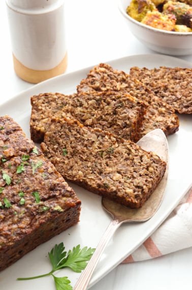 nut roast slices on a white serving platter.