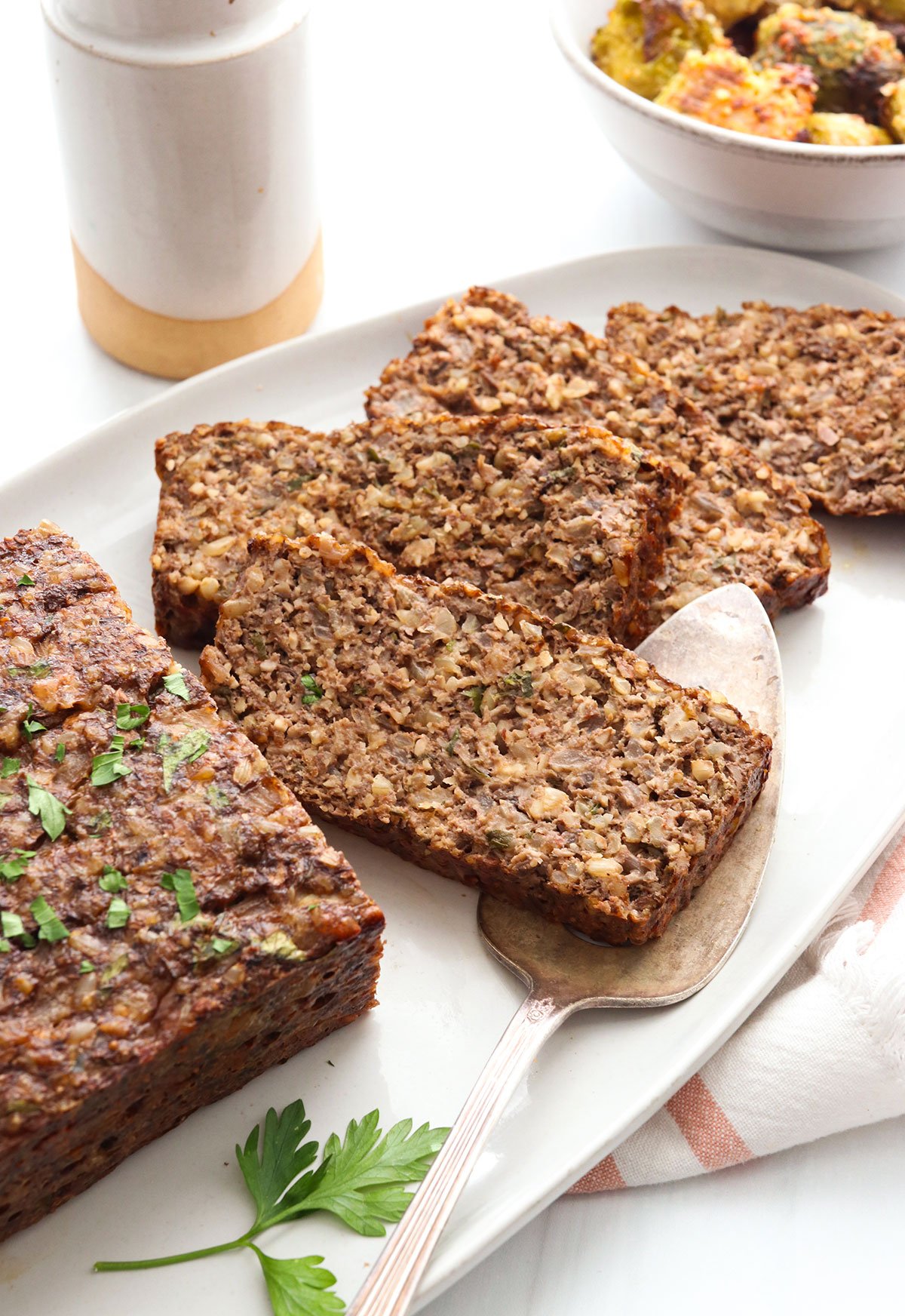 nut roast slices on a white serving platter.