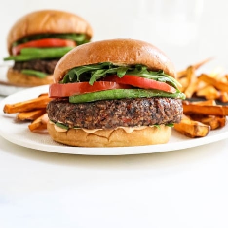 veggie burgers on white plates