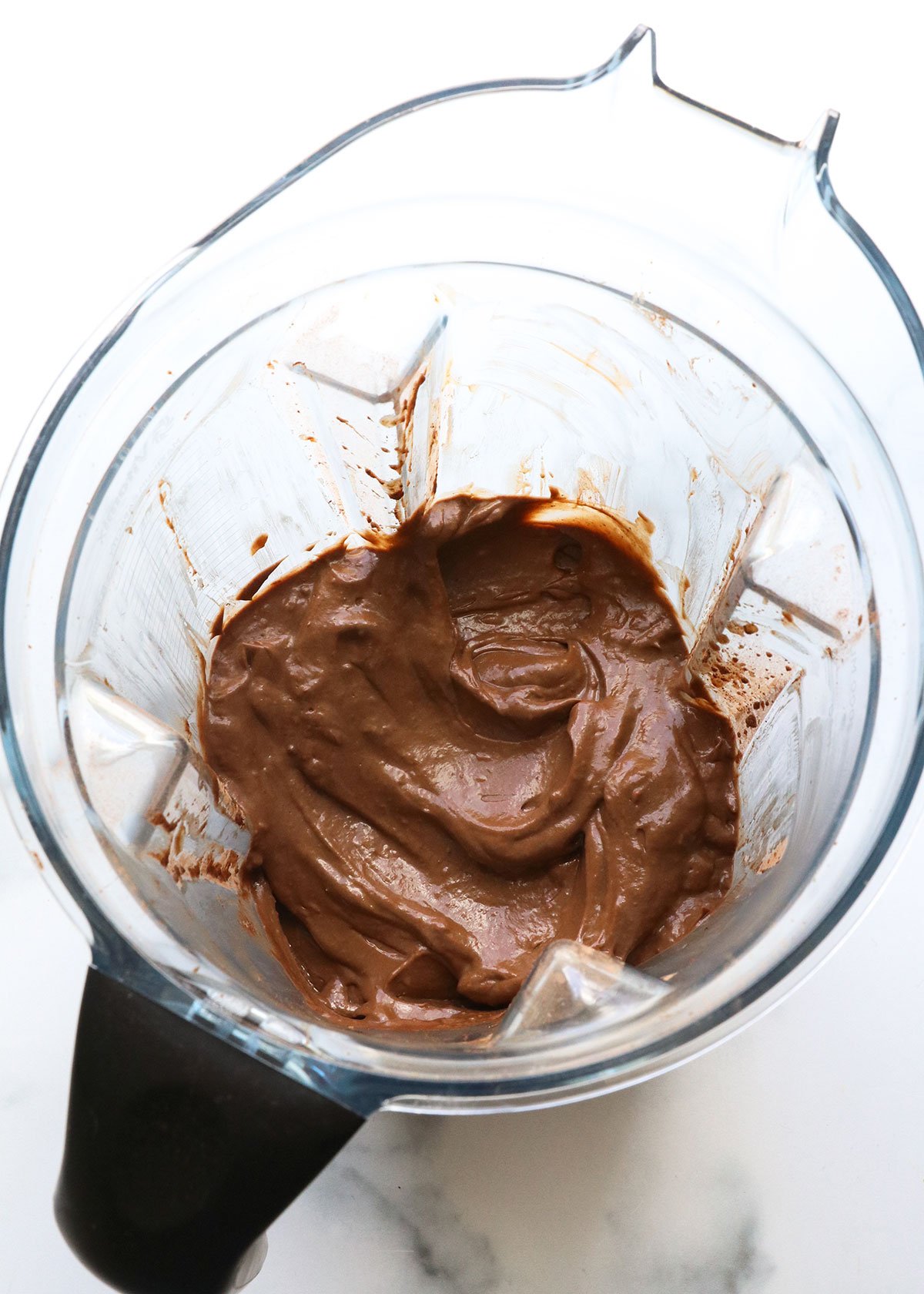 blended avocado pudding in a blender container.