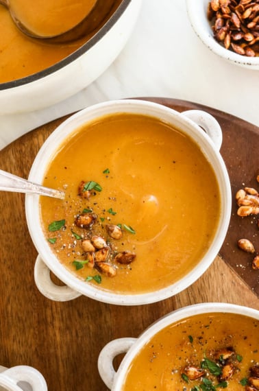 butternut squash soup served with roasted seeds on top.