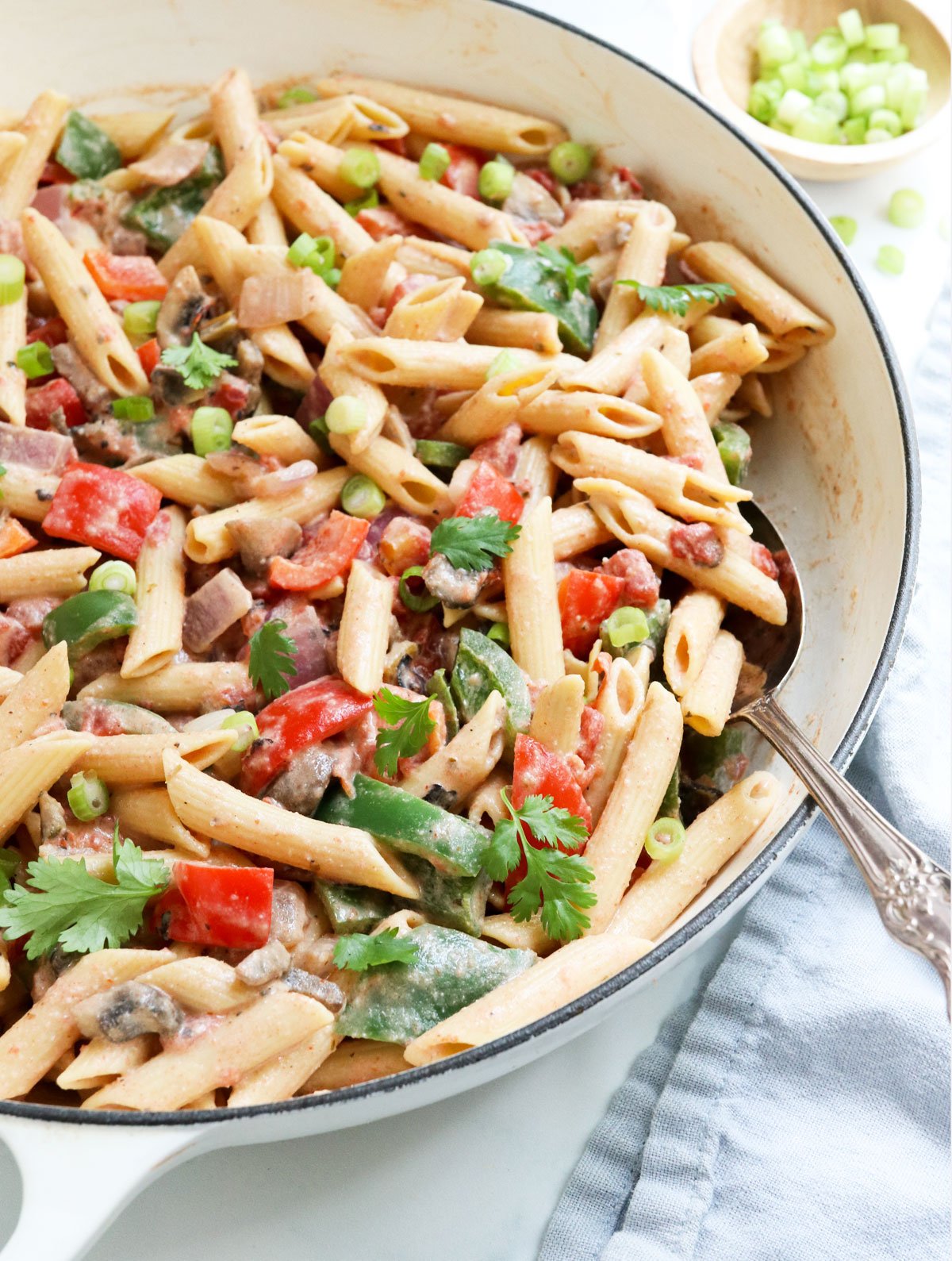 cajun pasta ready to be served from white skillet