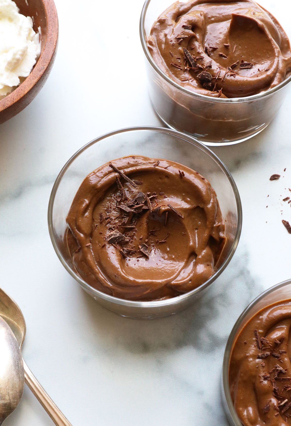 avocado pudding served with chocolate shavings on top.