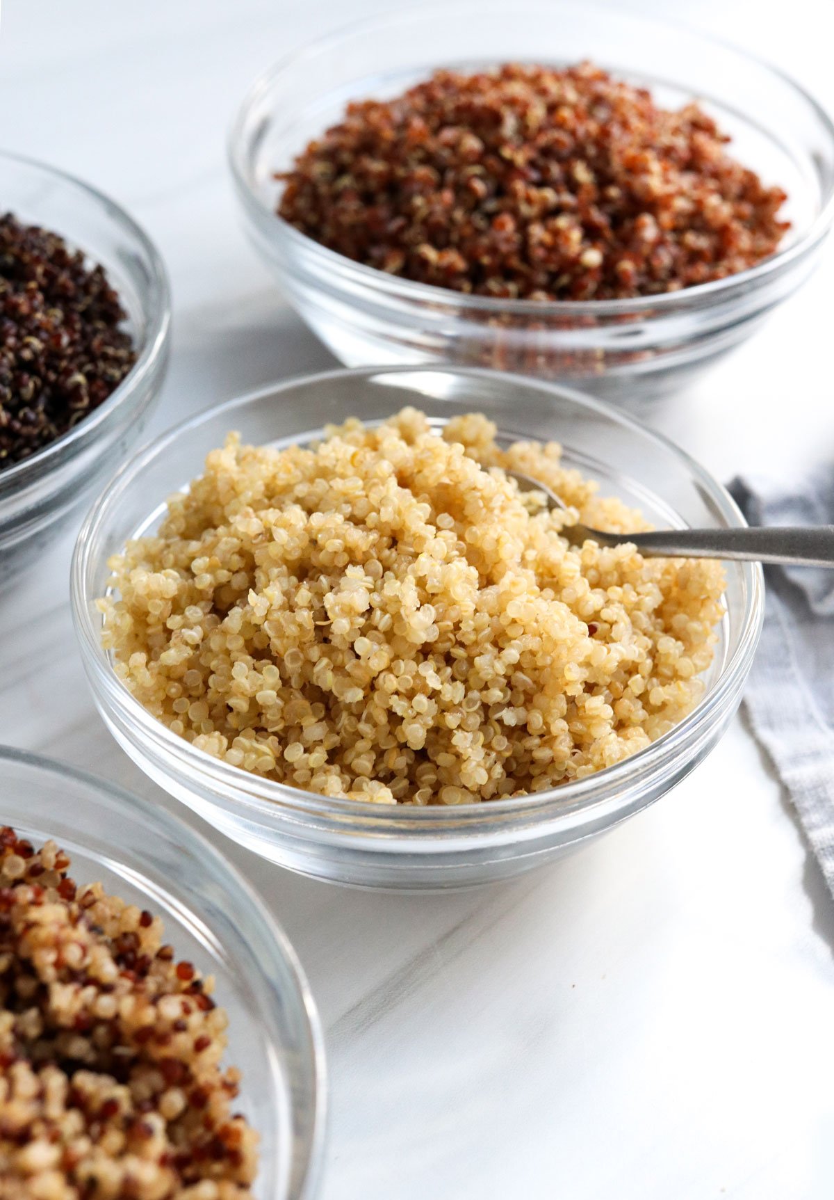 cooked quinoa in glass bowls.