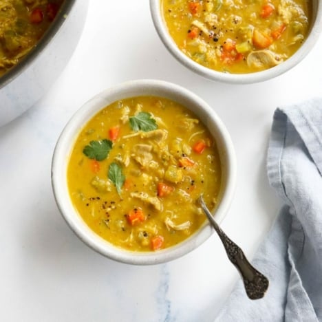 curry chicken soup in white bowls