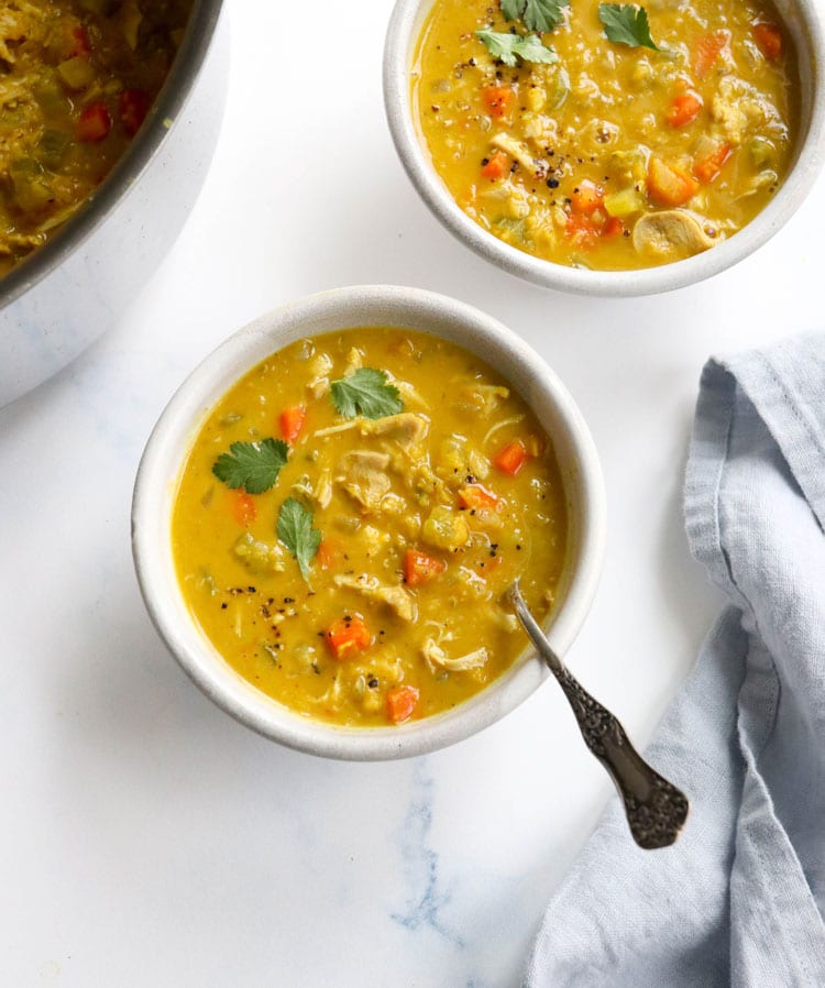 curry chicken soup in white bowls