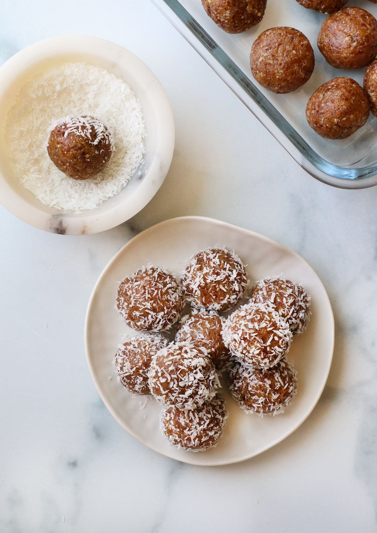 date balls rolled in a bowl of shredded coconut.