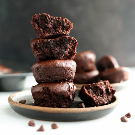 date brownies stacked on dark plate.