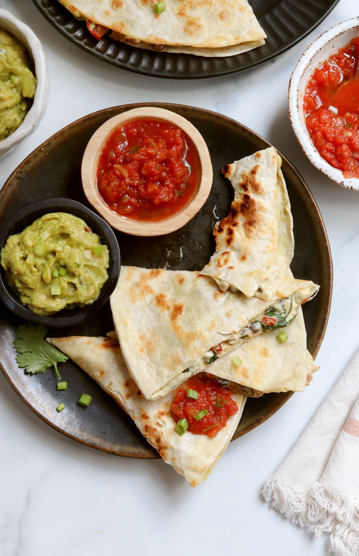 quesadilla eaten on black plate