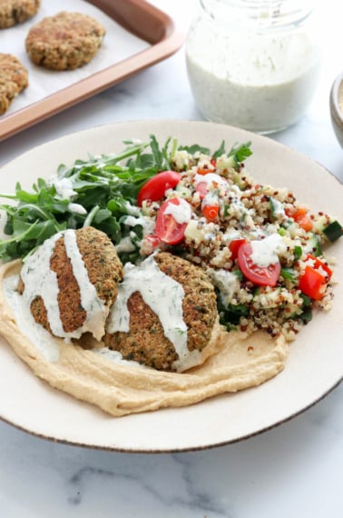 falafel bowl topped with tahini dressing