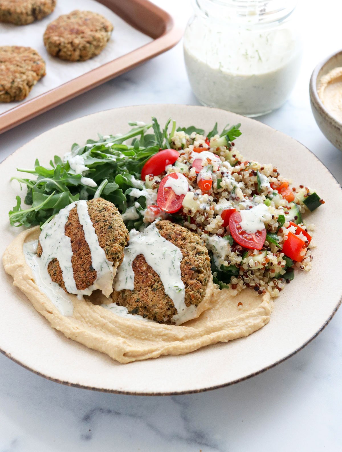 falafel bowl topped with tahini dressing