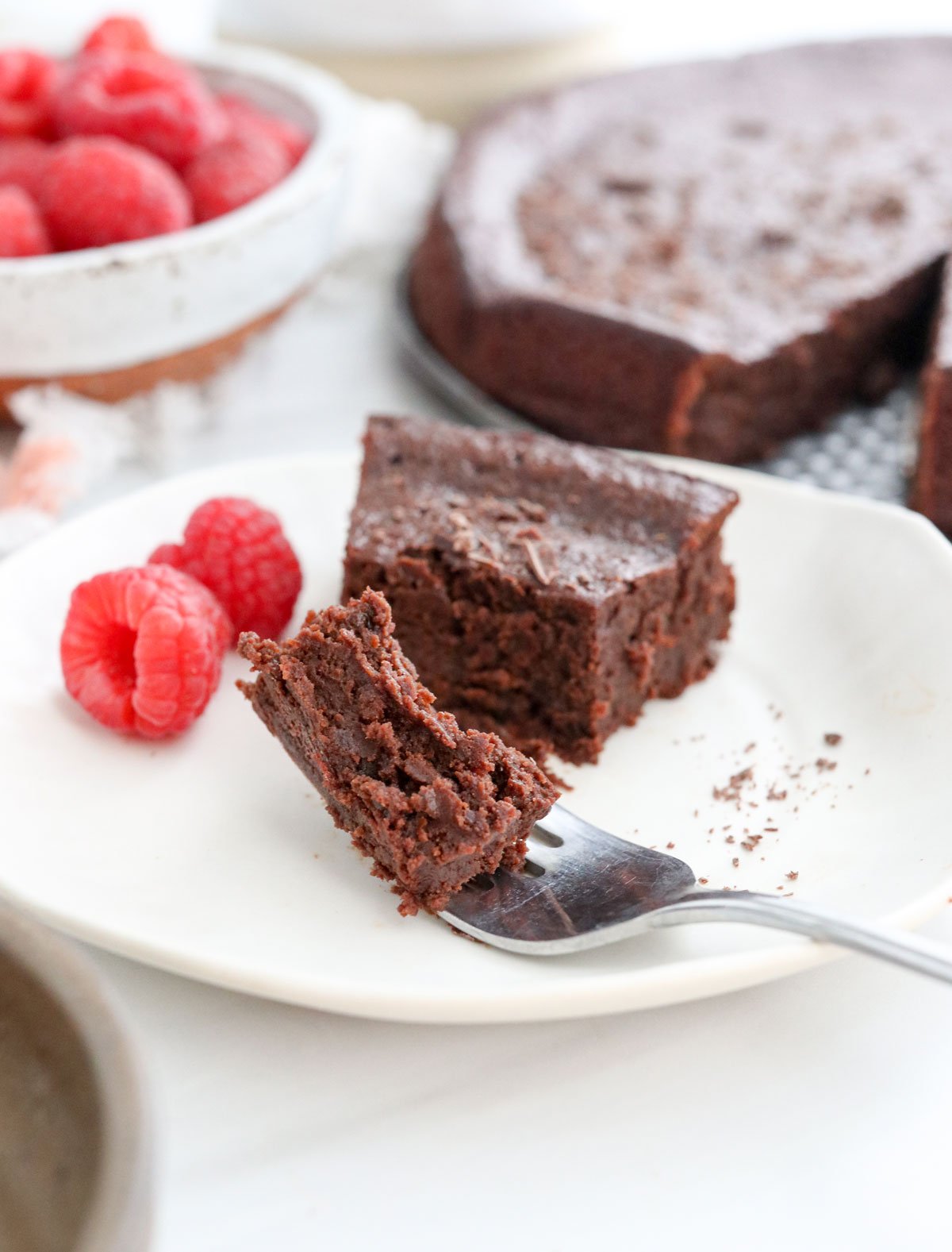 fudgy flourless cake bite on a fork.