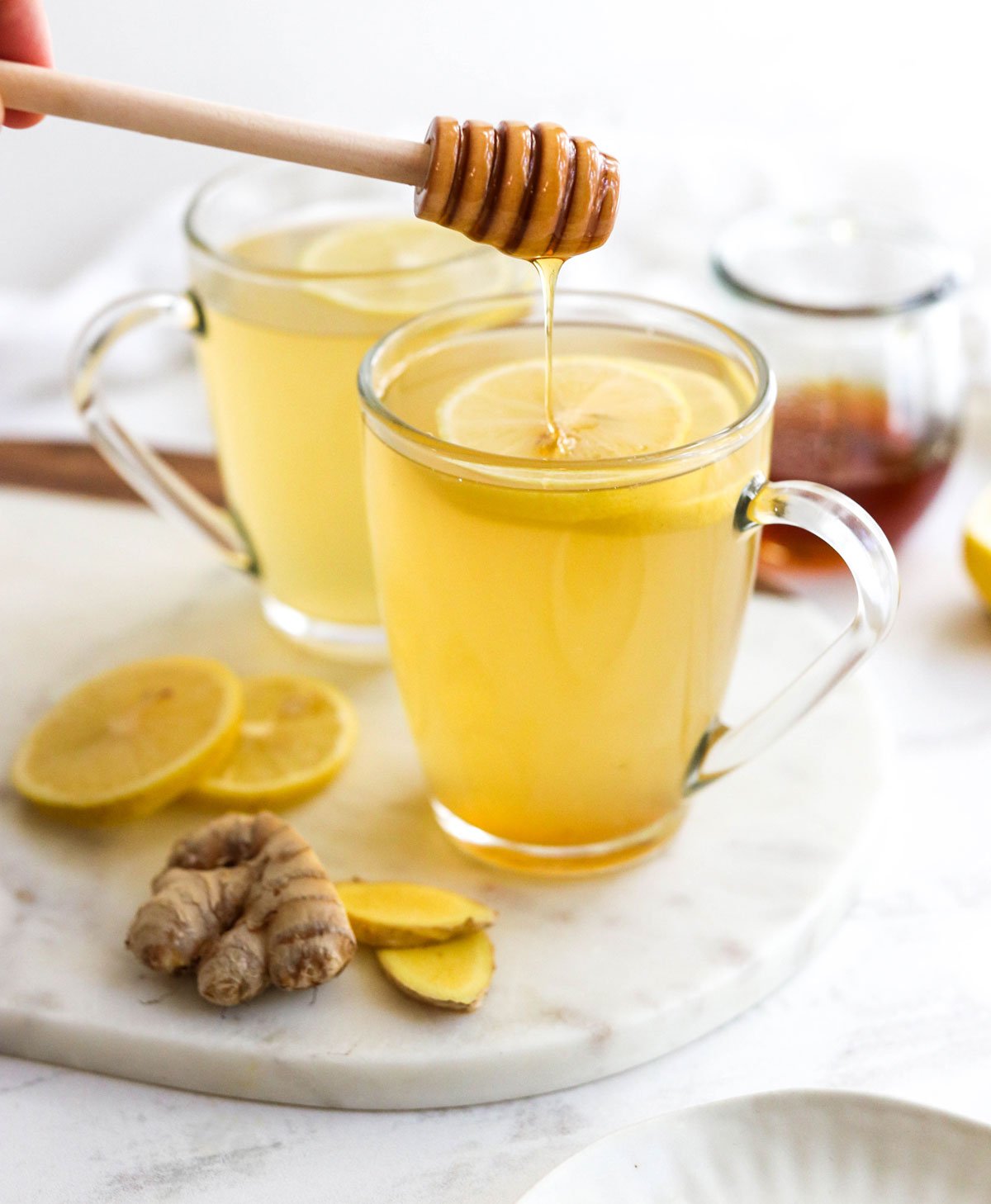 honey added to cup of ginger tea