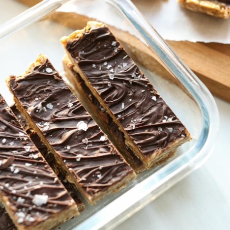 chocolate covered granola bars in storage container.