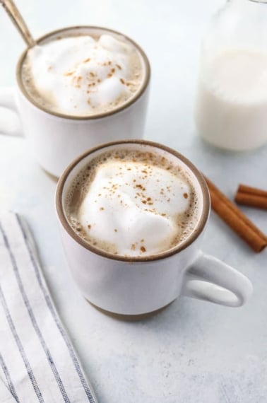 healthy chai latte recipe in two white mugs