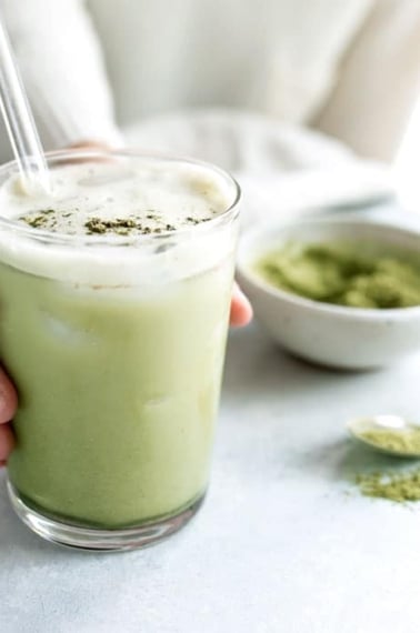 matcha latte in a glass on white