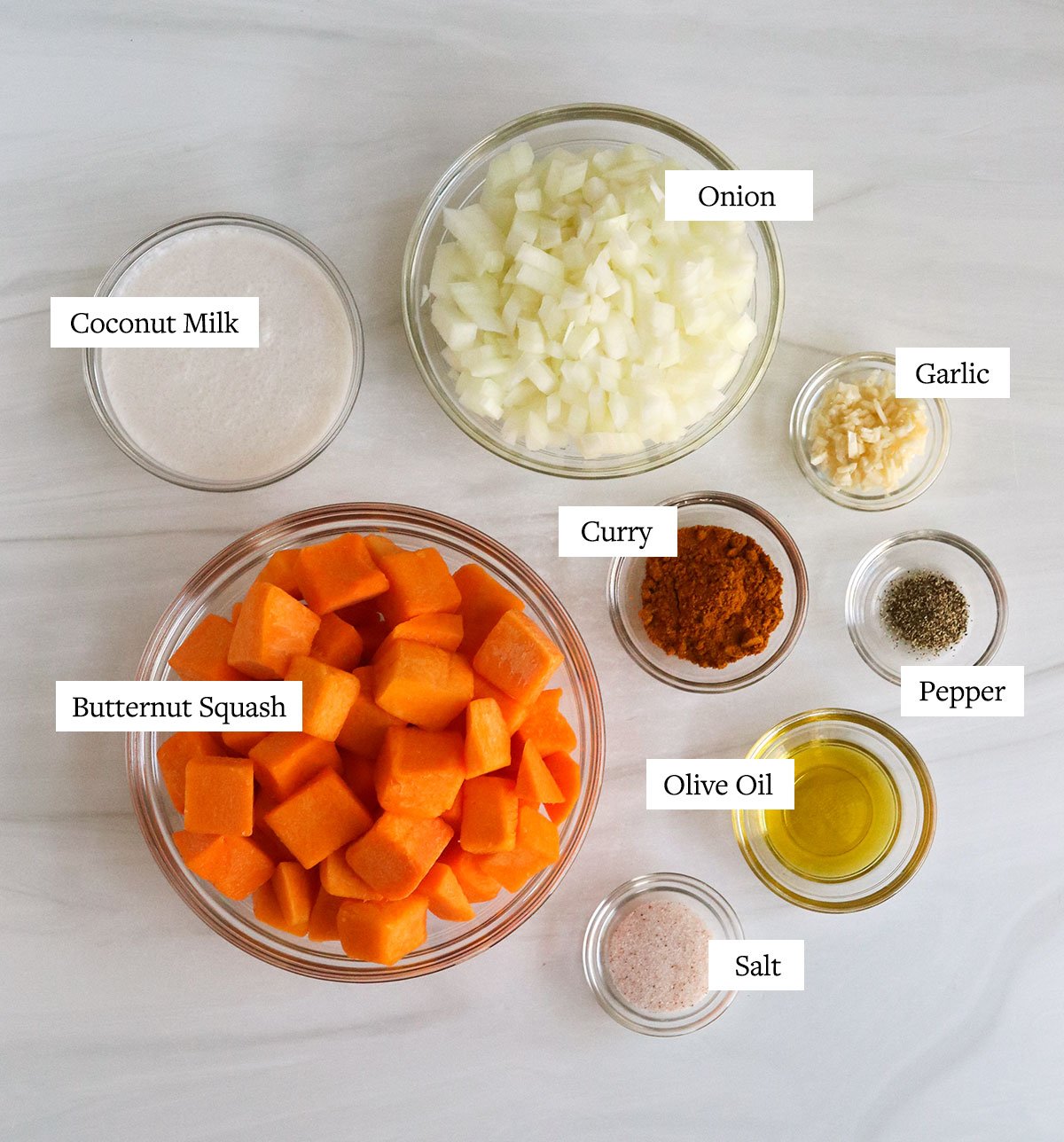 Instant Pot Butternut soup ingredients labeled in glass bowls.