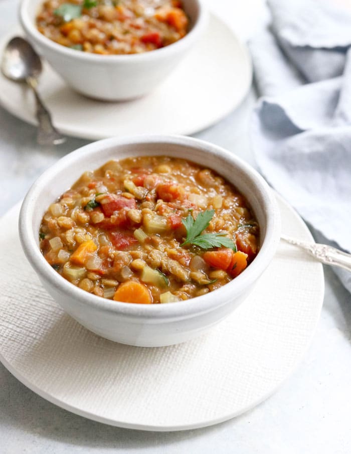 Instant Pot lentil soup in a white bowl