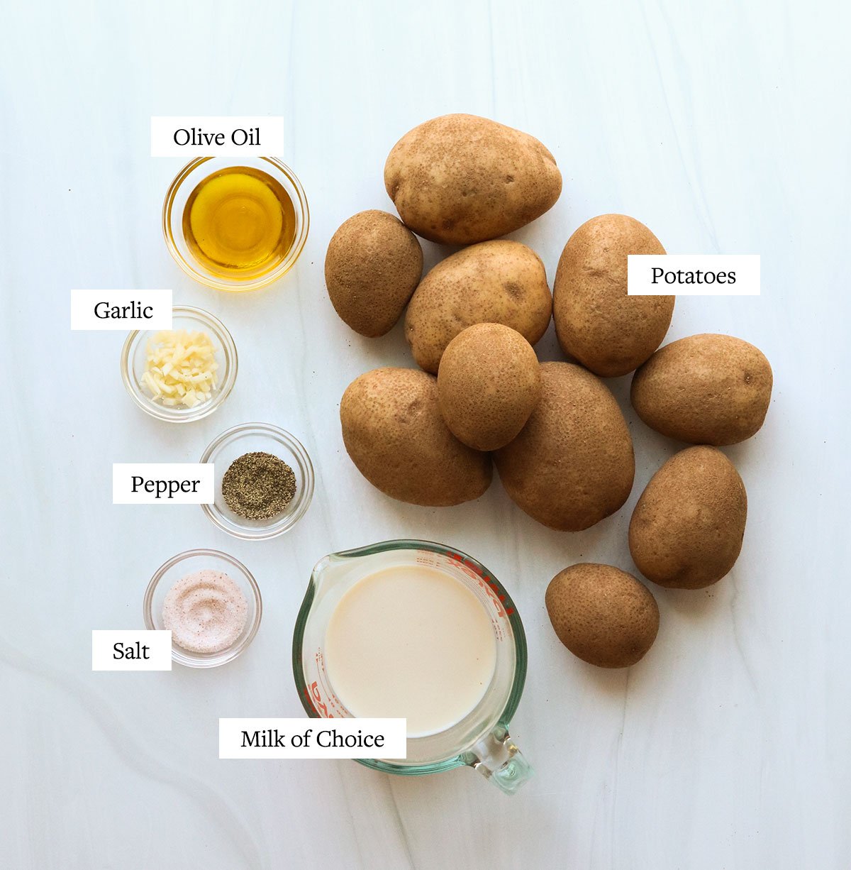 mashed potato ingredients labeled on a white surface.