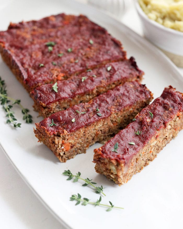 vegan meatloaf slices on a white plate