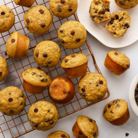 mini banana chocolate chip muffins cooling on a wire rack.