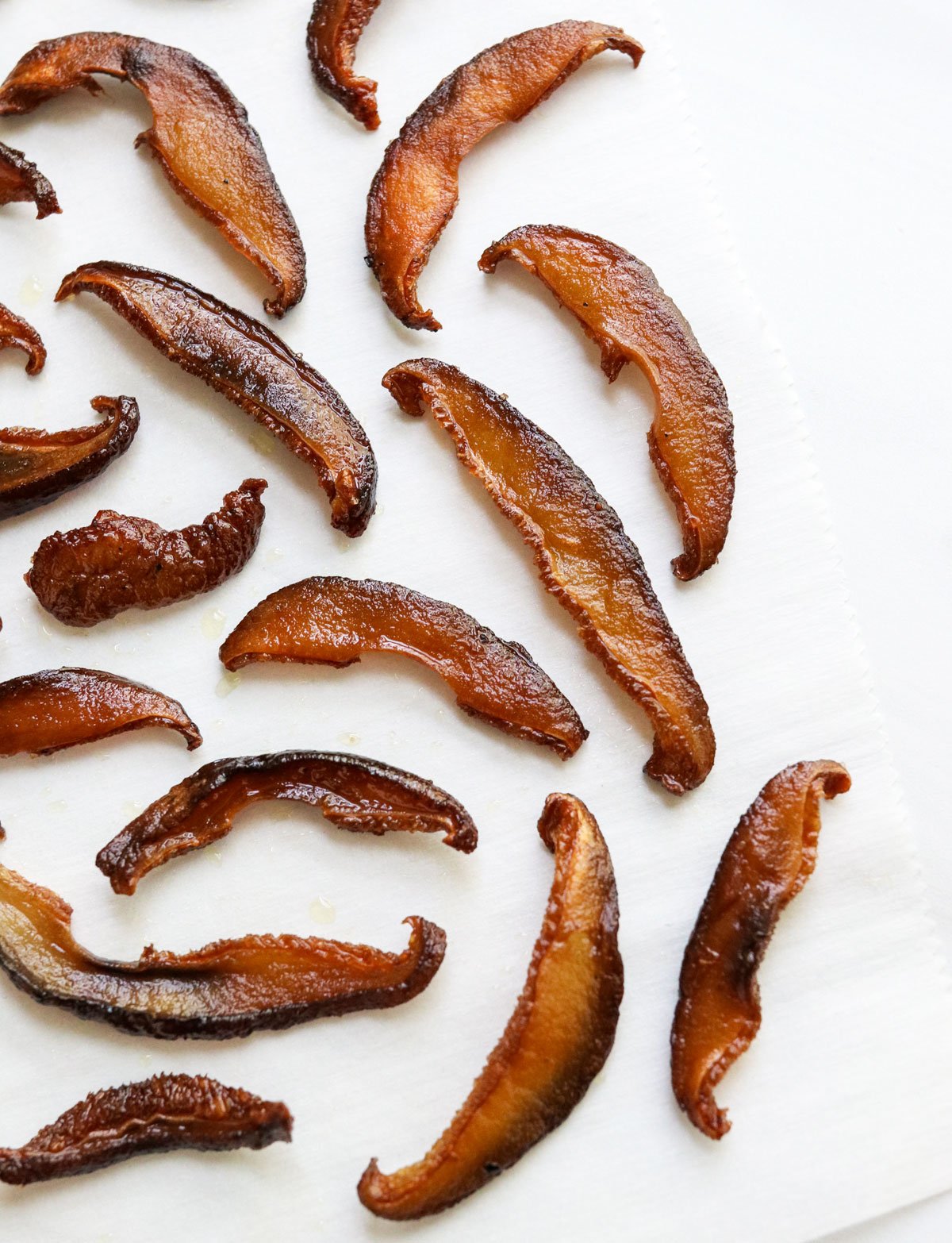 mushroom bacon on white surface.