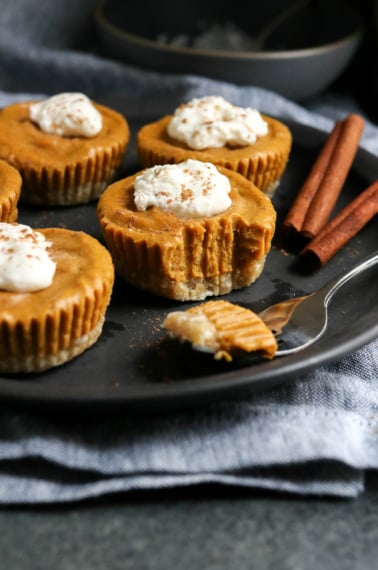 vegan pumpkin tarts on black plate