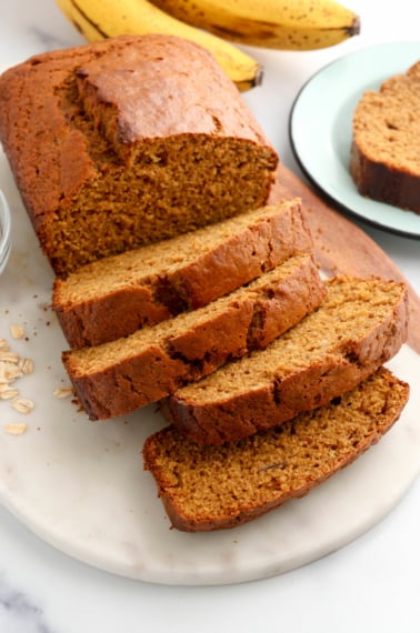 oat flour banana bread sliced on marble board