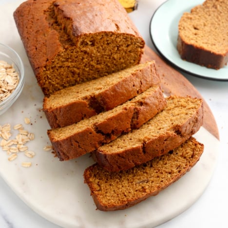 oat flour banana bread sliced on marble board