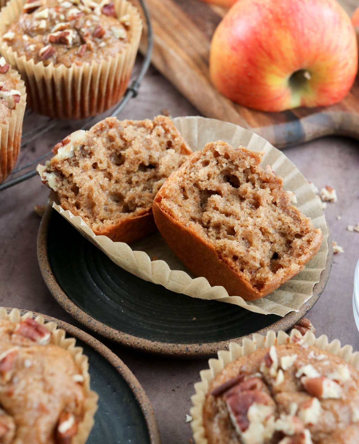 apple spice muffin split in half on plate