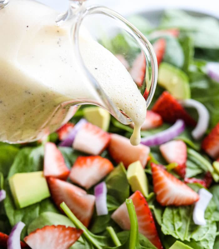 lemon poppy seed dressing poured over salad