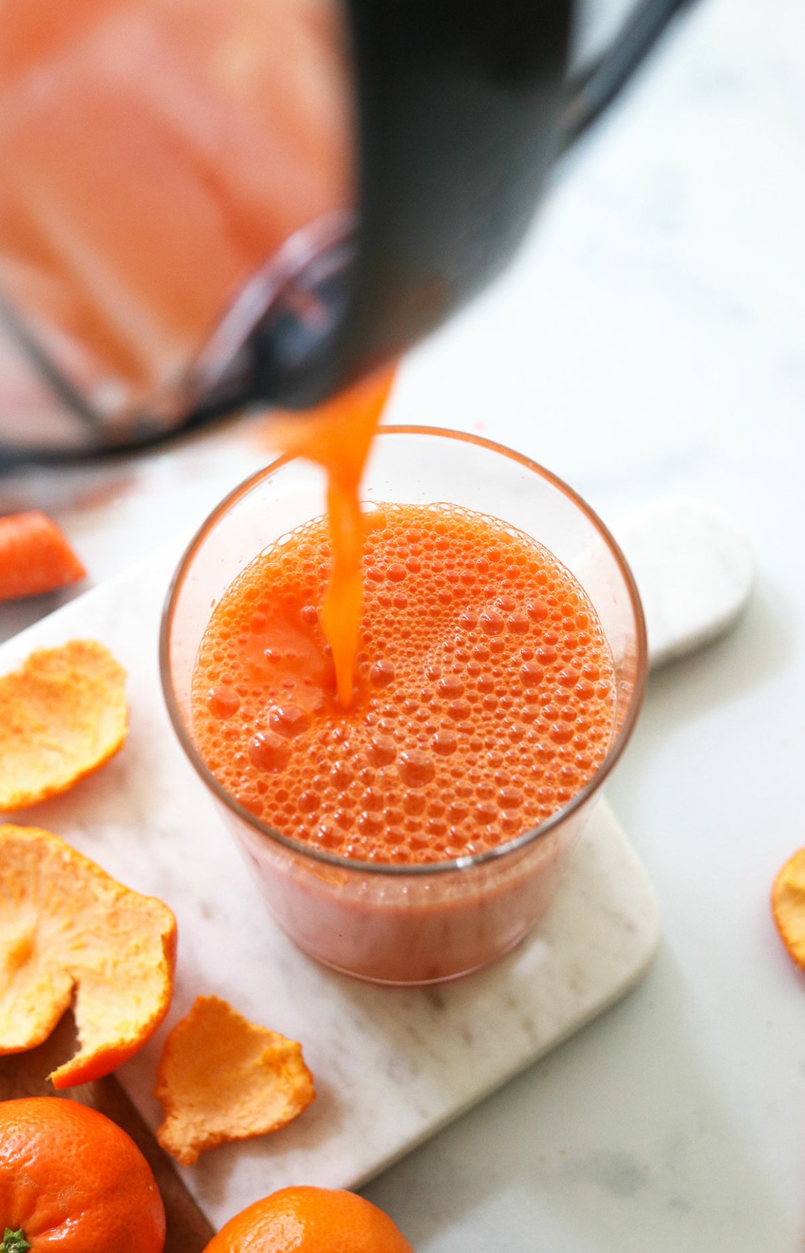 juice poured into a glass from the juicing pitcher.