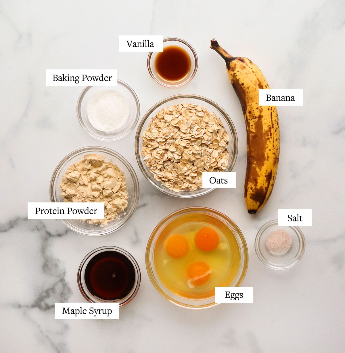 protein pancake ingredients labeled on a white surface.