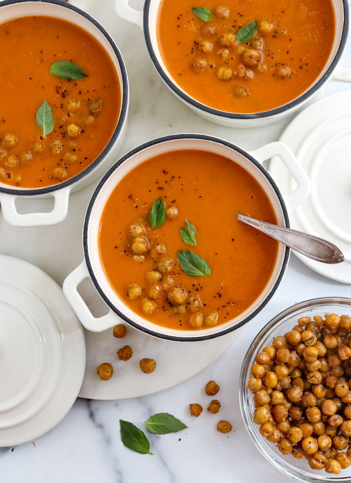 roasted tomato soup in 3 white bowls