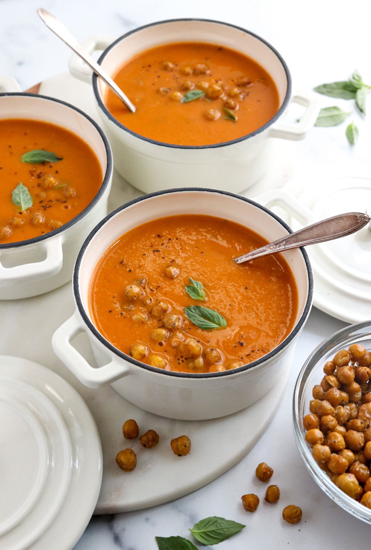 roasted tomato soup with chickpeas and basil on top