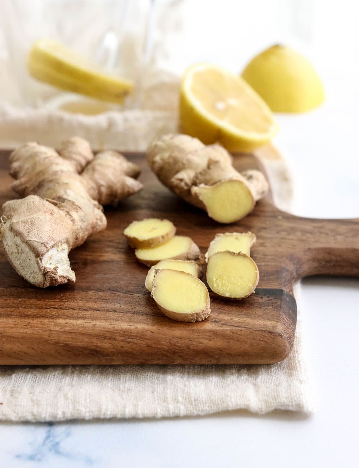 sliced ginger on cutting board