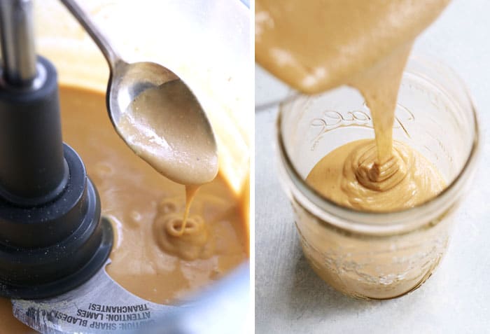 smooth almond butter going into jar