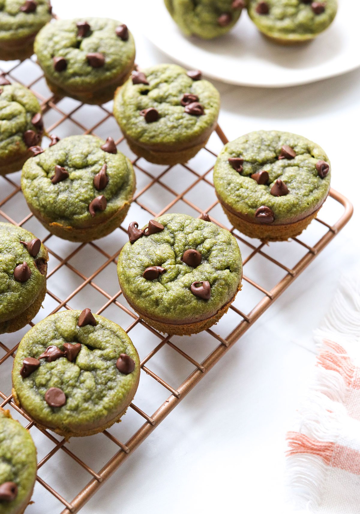 spinach muffins cooling on a wire rack. 