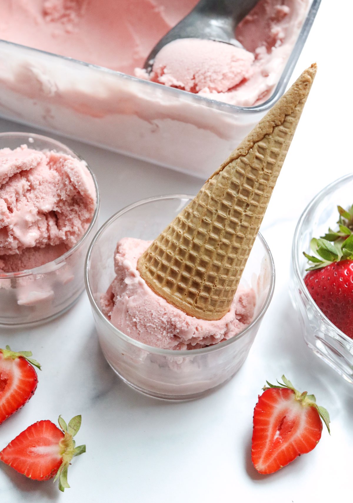 strawberry ice cream with cone and strawberries