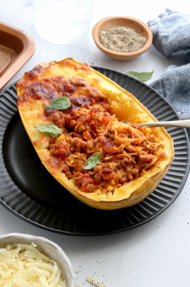 stuffed spaghetti squash at an angle on plate