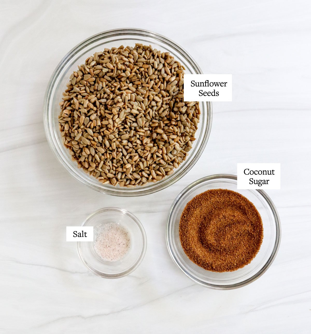 sunflower seed butter ingredients labeled in glass bowls.