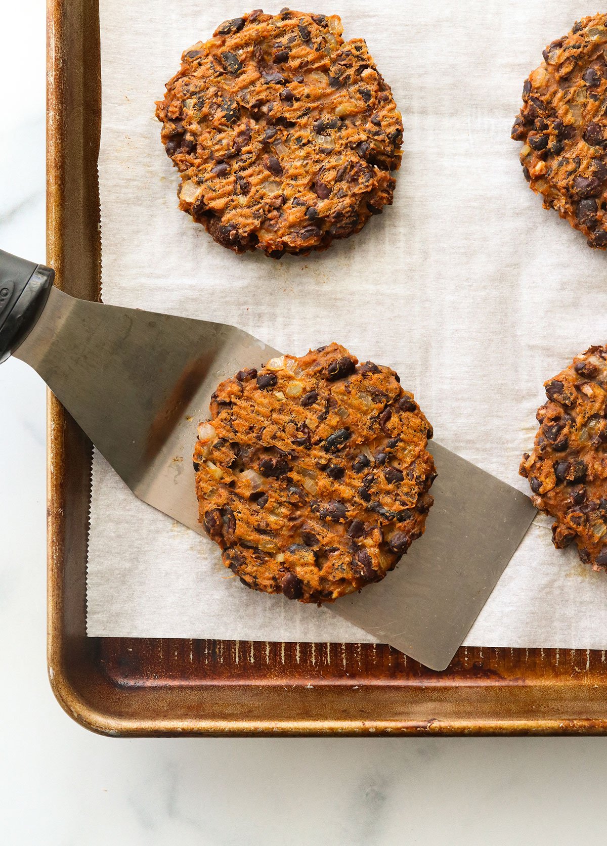 sweet potato black bean burger cooked on a baking sheet.