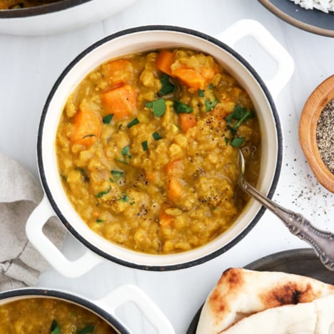 sweet potato curry with spoon in small bowl