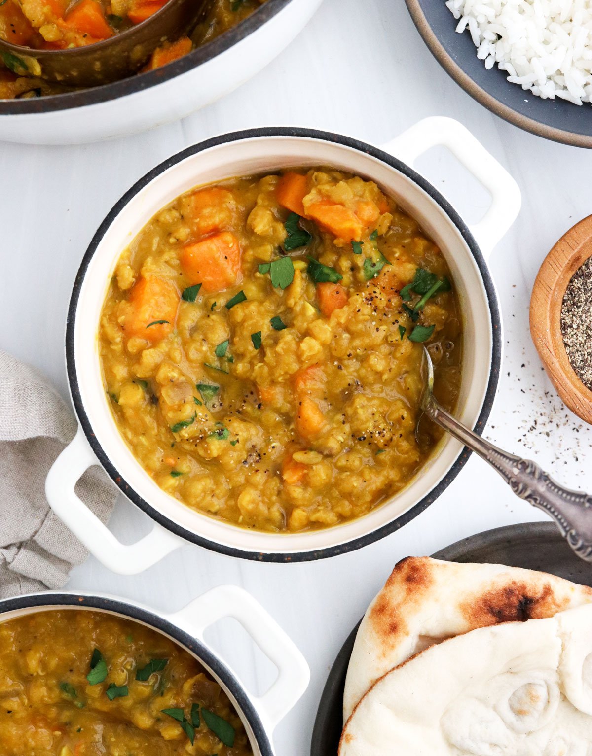 sweet potato curry with spoon in small bowl