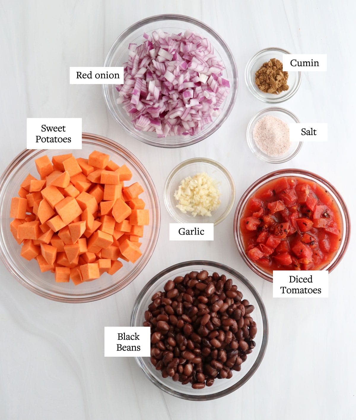 sweet potato enchilada filling ingredients in glass bowls