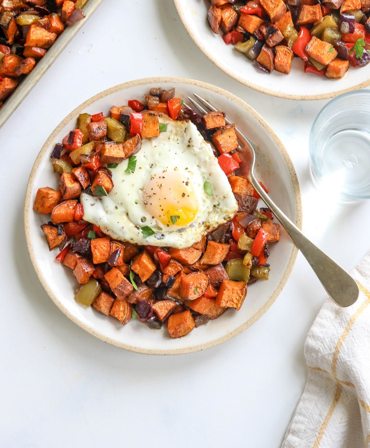 sweet potato hash on plate with egg