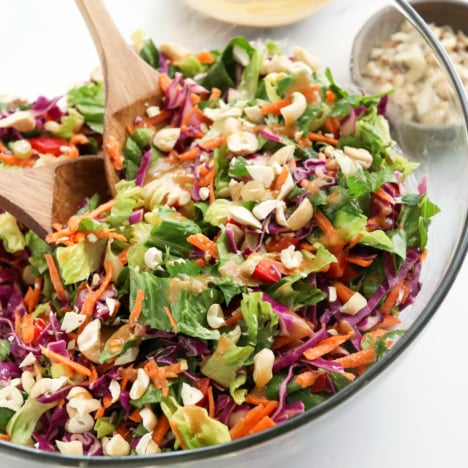 thai salad with peanut dressing in glass bowl